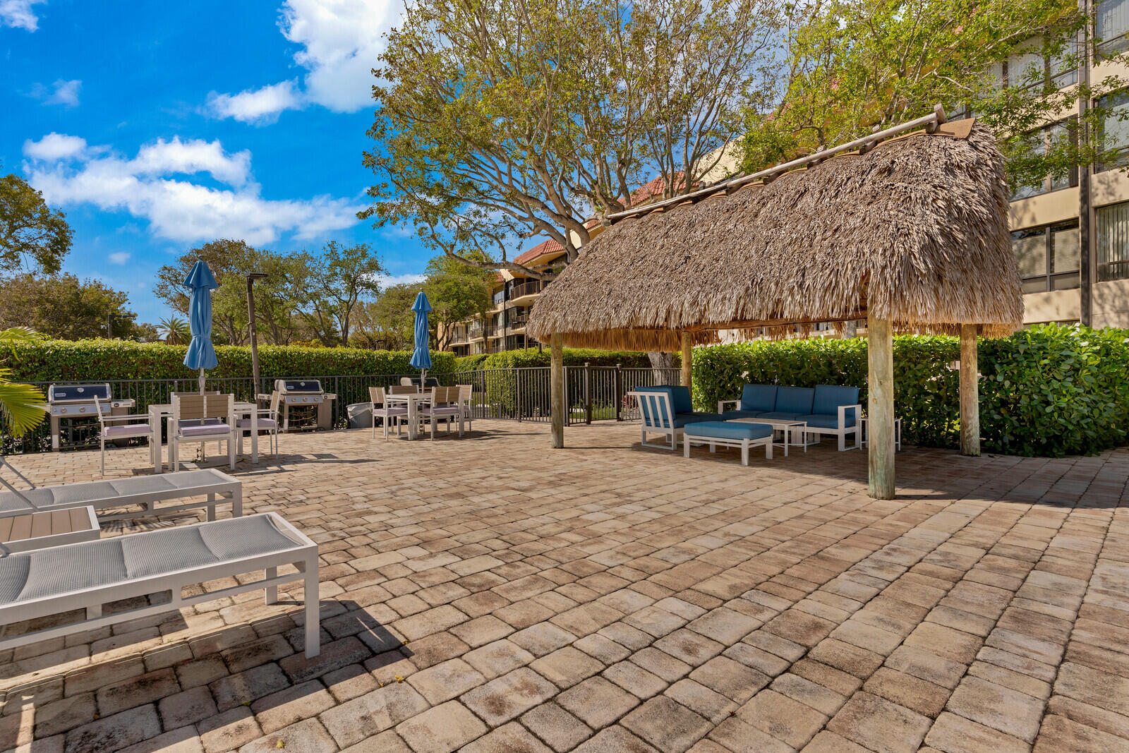 799 Jeffery Street, Unit 4070 Boca Raton, FL 33487 - Photo 30 of 41 a view of a patio with table and chairs and potted plants