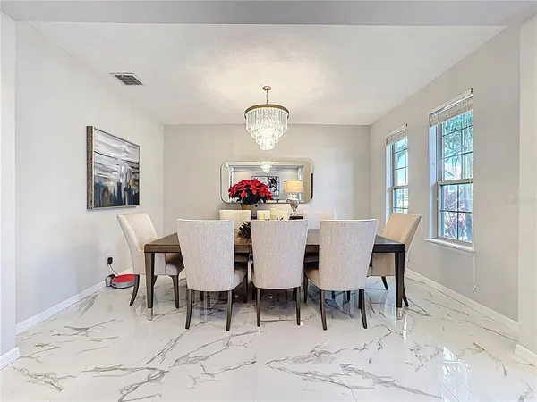 a living room with furniture and a christmas tree