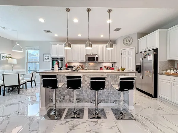 a dining room with furniture and window