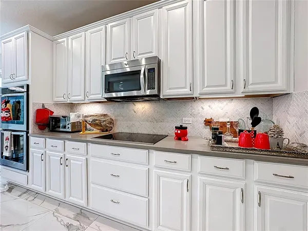 a work room with furniture and wooden floor
