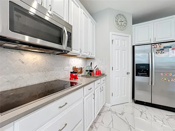 a bathroom with a granite countertop sink mirror and toilet