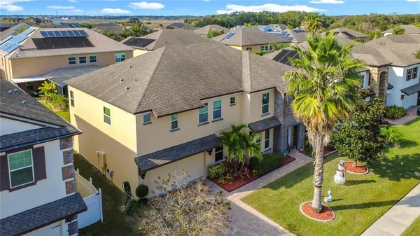 an aerial view of residential houses with outdoor space