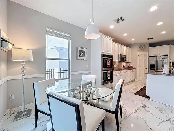 a bedroom with a bed and a night stand