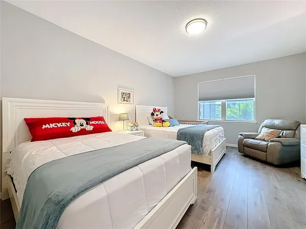 a bedroom with furniture and a fireplace