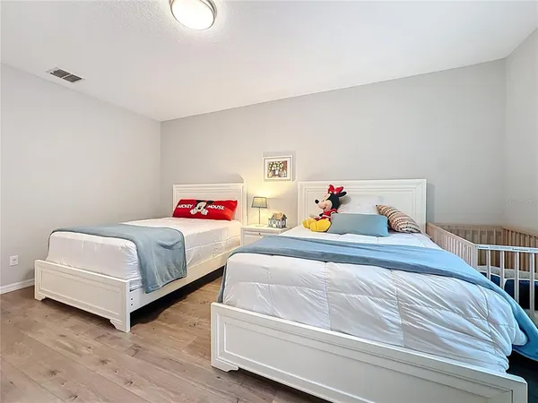 a bathroom with a shower and a sink