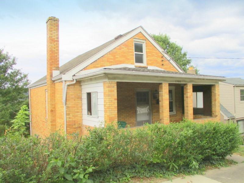 1705 North Walnut Street Ambridge, PA 15003 - Photo 1 of 30 a front view of a house with a yard