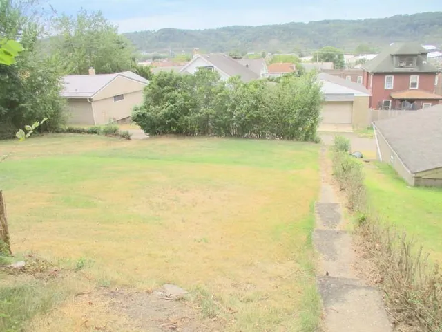 a view of a city with an ocean view