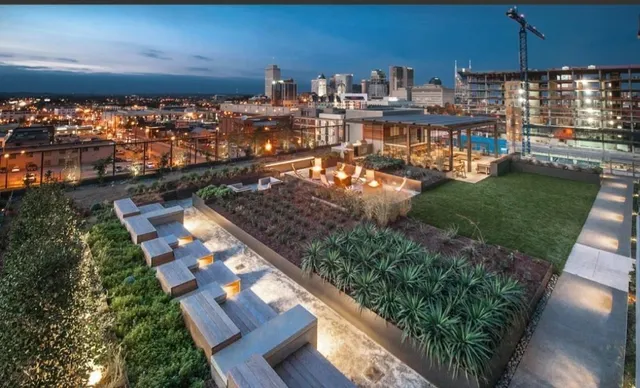 a living room with lots of furniture and a rug