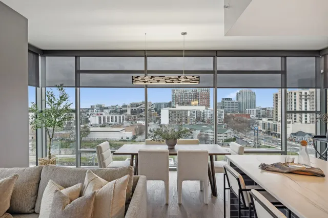 a view of a dining room with furniture window and outside view