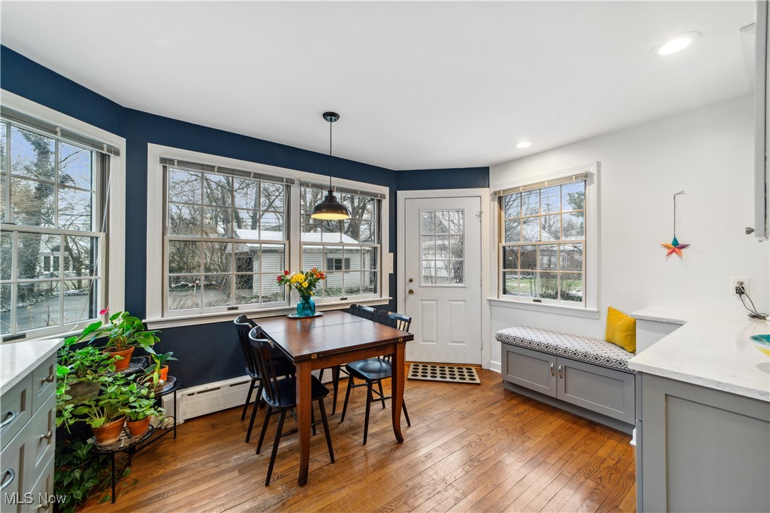 17027 Fernway Road Cleveland, OH 44120 - Photo 13 of 42 Dining space with a baseboard heating unit, a wealth of natural light, recessed lighting, and wood-type flooring