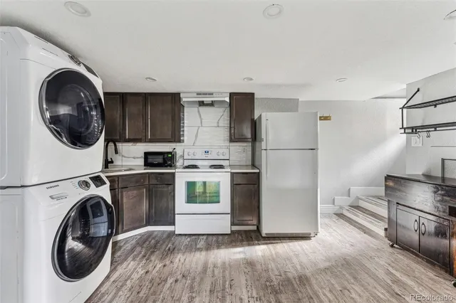 a kitchen with a washer and dryer