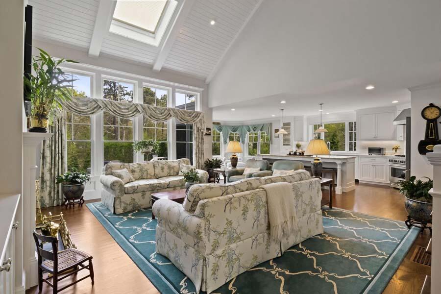 19 Bascom Hollow Harwich, MA 02645 - Photo 18 of 43 a living room with fireplace furniture and a large window