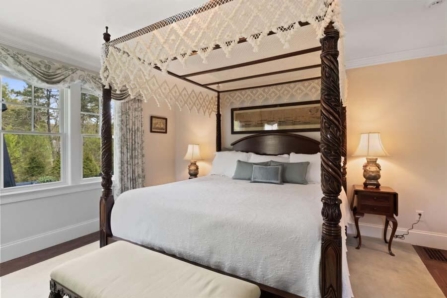 19 Bascom Hollow Harwich, MA 02645 - Photo 23 of 43 a bedroom with a bed and wooden floor