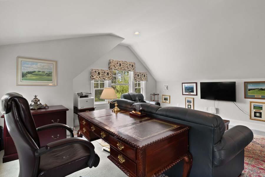 19 Bascom Hollow Harwich, MA 02645 - Photo 24 of 43 a living room with furniture a flat screen tv and a window