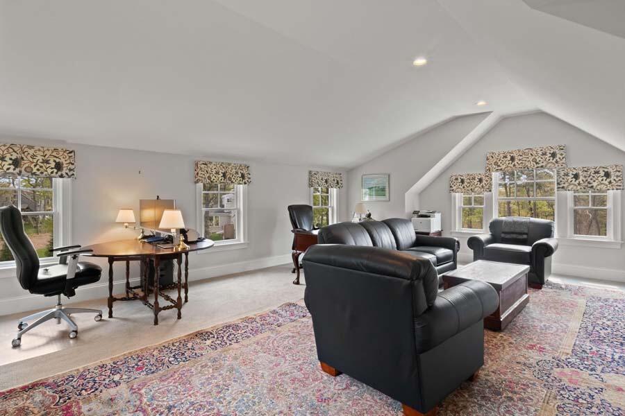 19 Bascom Hollow Harwich, MA 02645 - Photo 25 of 43 a living room with furniture a rug and a large window