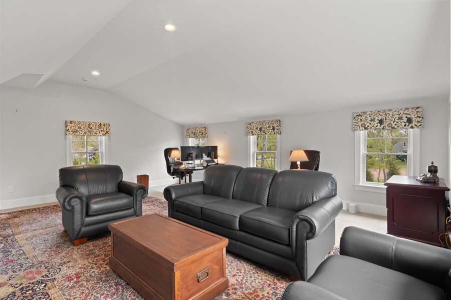 19 Bascom Hollow Harwich, MA 02645 - Photo 26 of 43 a living room with furniture a couch and a window