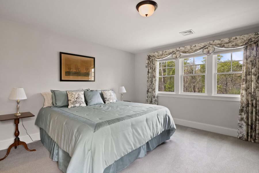 19 Bascom Hollow Harwich, MA 02645 - Photo 28 of 43 a bedroom with a bed and a large window