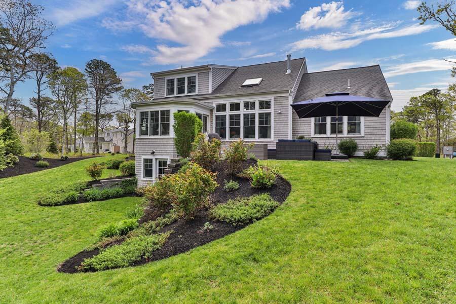 19 Bascom Hollow Harwich, MA 02645 - Photo 32 of 43 a front view of house with yard and green space