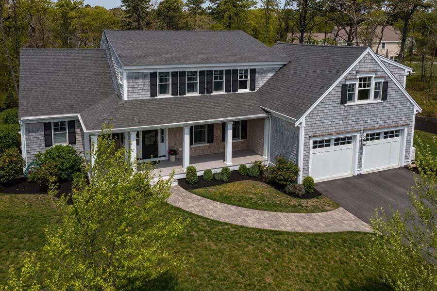 19 Bascom Hollow Harwich, MA 02645 - Photo 34 of 43 front view of a house with a yard