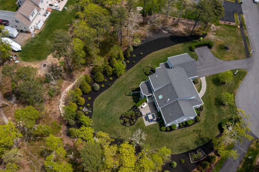 19 Bascom Hollow Harwich, MA 02645 - Photo 38 of 43 an aerial view of a house with a yard