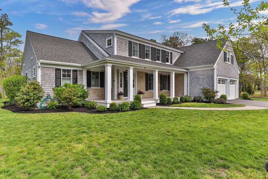 19 Bascom Hollow Harwich, MA 02645 - Photo 43 of 43 a front view of house with yard and green space
