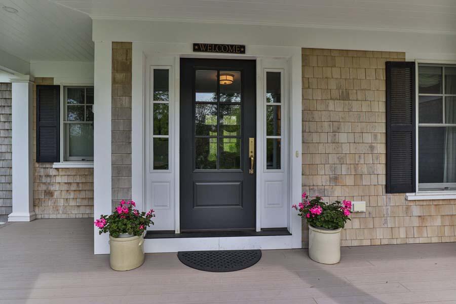 19 Bascom Hollow Harwich, MA 02645 - Photo 5 of 43 a potted plant sitting in front of a house