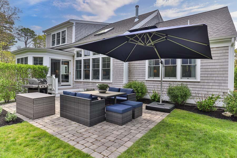 19 Bascom Hollow Harwich, MA 02645 - Photo 9 of 43 a view of an house with backyard and patio