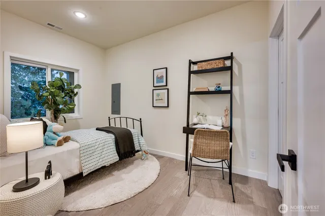 a bedroom with a bed and a chair