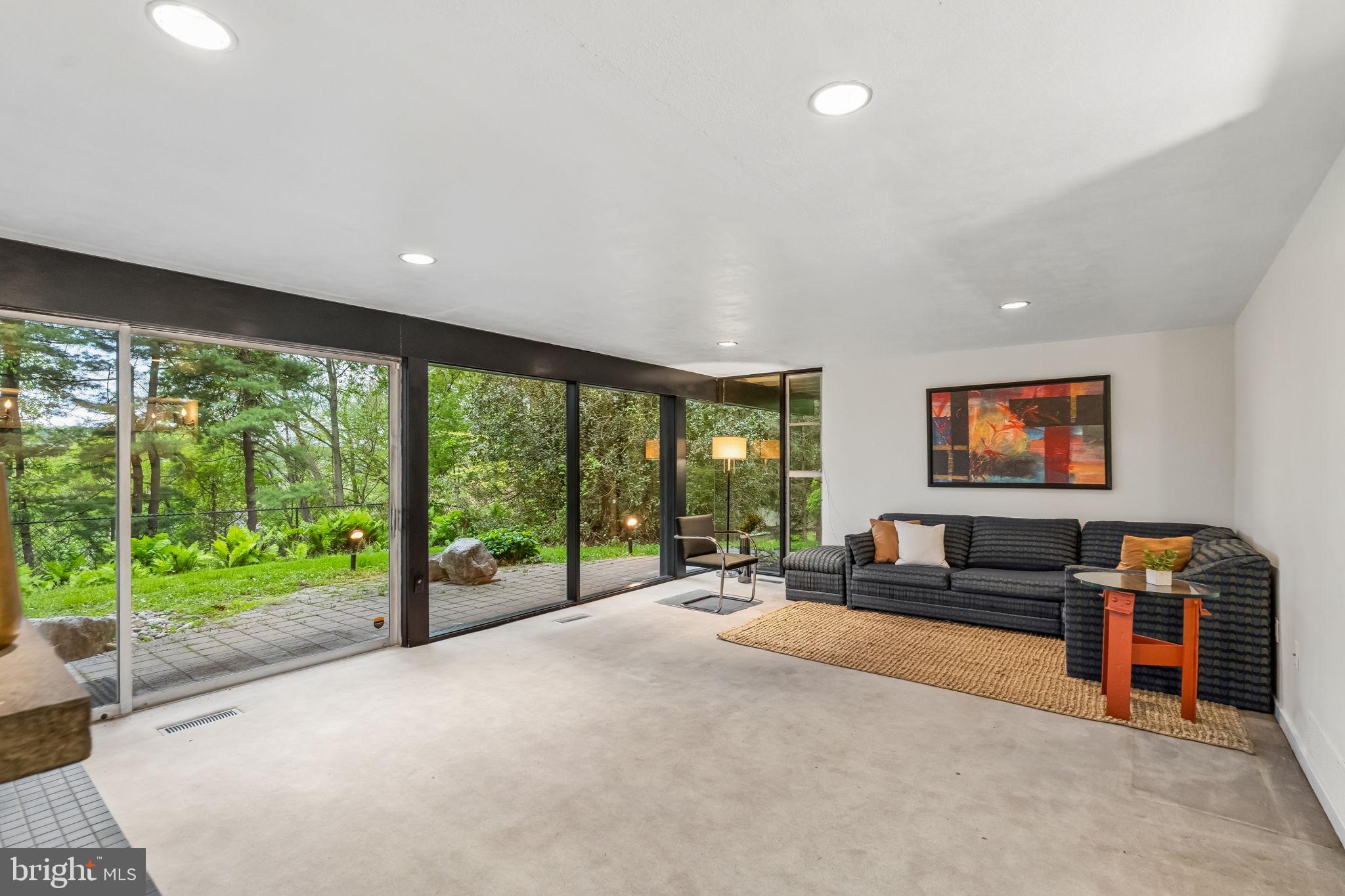 1640 Monk Road Gladwyne, PA 19035 - Photo 26 of 41 a living room with furniture and a flat screen tv