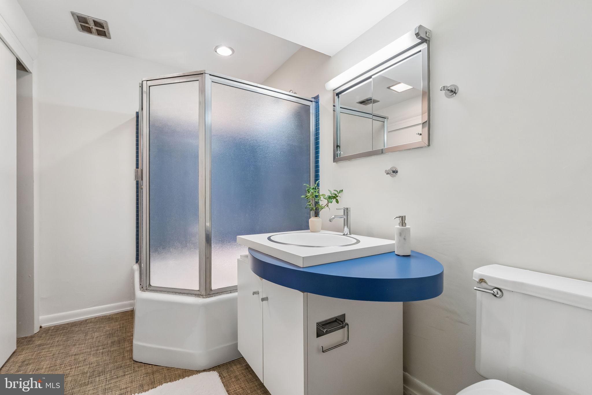 1640 Monk Road Gladwyne, PA 19035 - Photo 32 of 41 a bathroom with a sink a mirror and a toilet