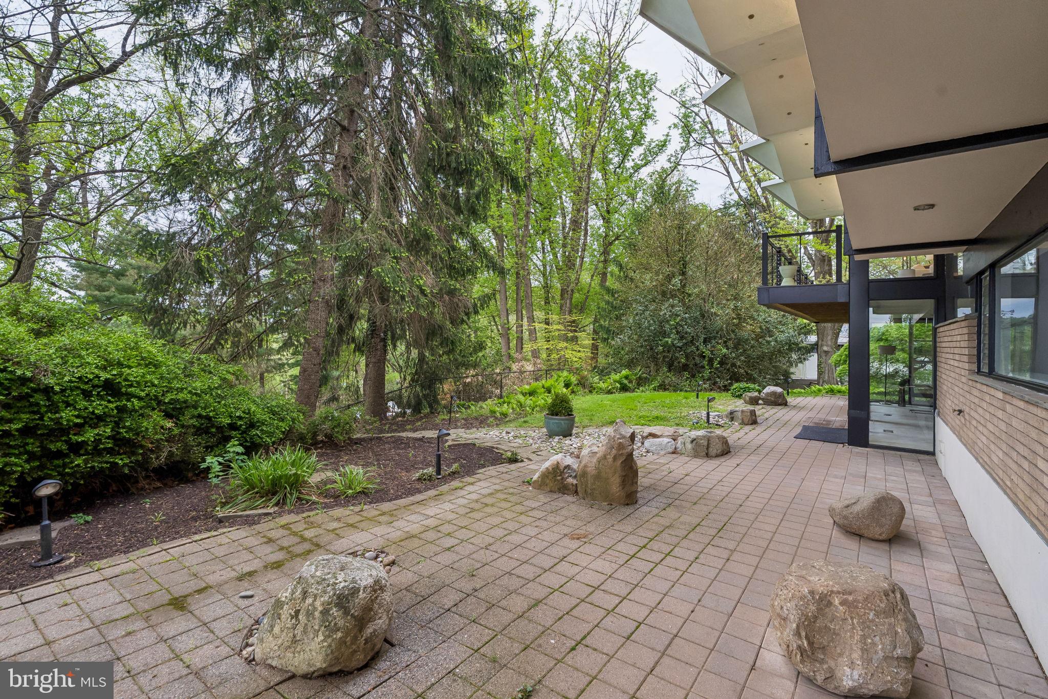 1640 Monk Road Gladwyne, PA 19035 - Photo 33 of 41 a view of a backyard with table and chairs