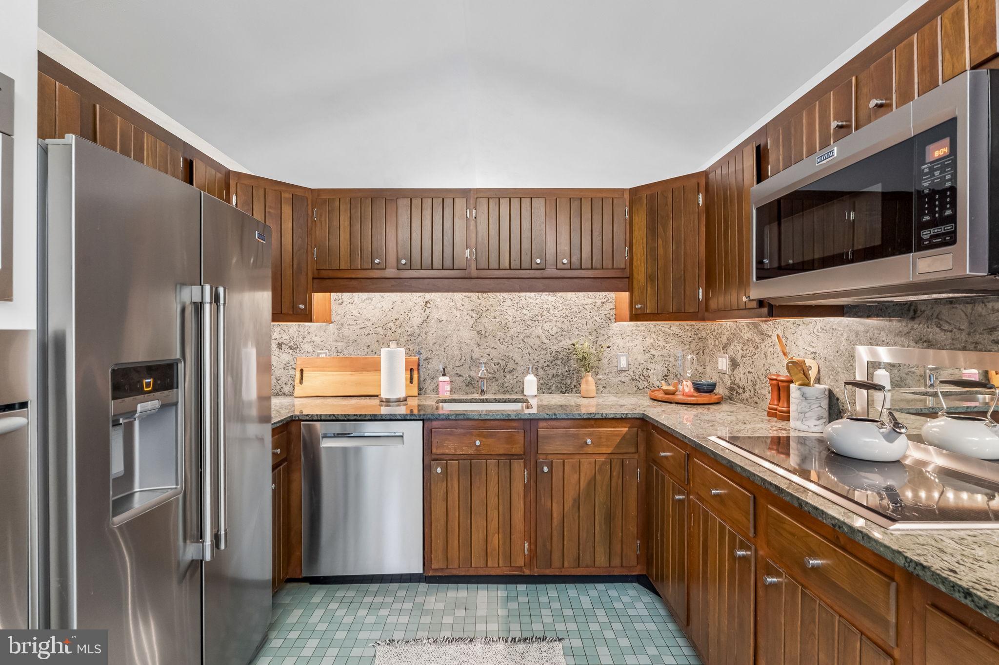 1640 Monk Road Gladwyne, PA 19035 - Photo 5 of 41 a kitchen with stainless steel appliances granite countertop a refrigerator sink and microwave