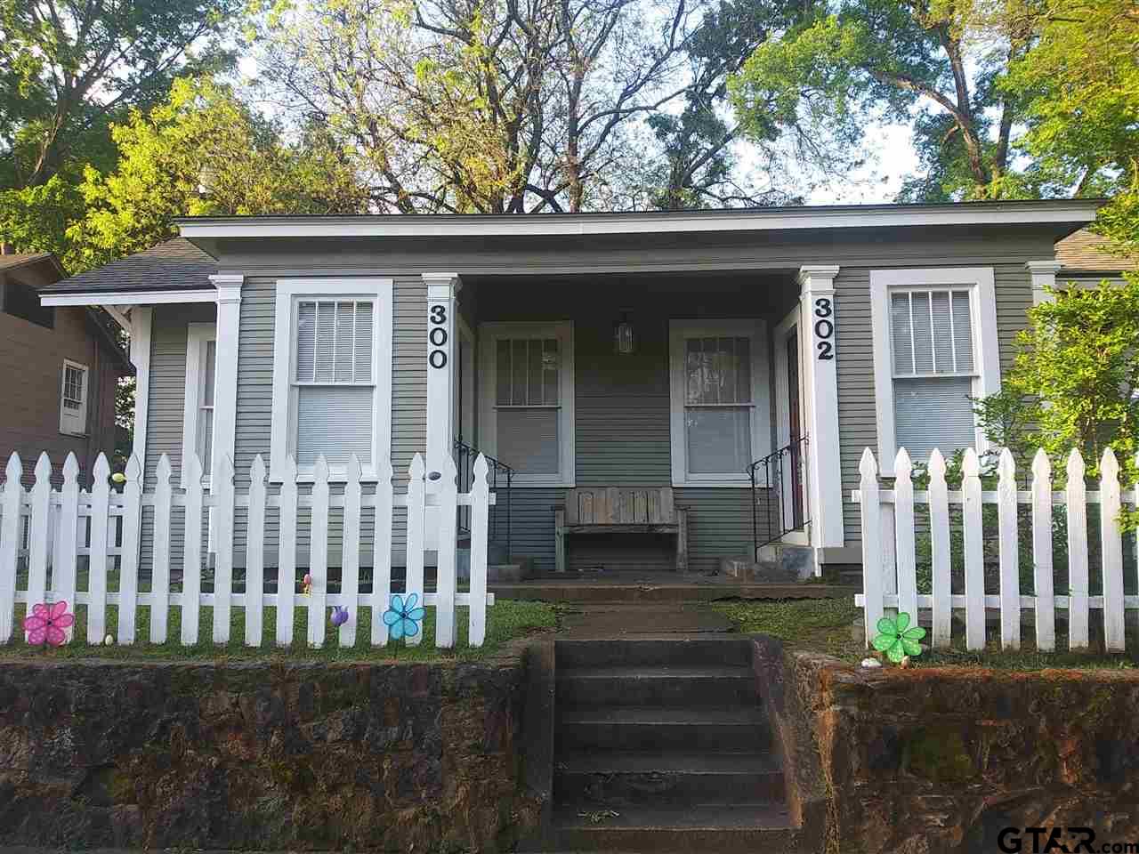 302 West Bryan Street Tyler, TX 75702 - Photo 1 of 7 a front view of a house with a garden