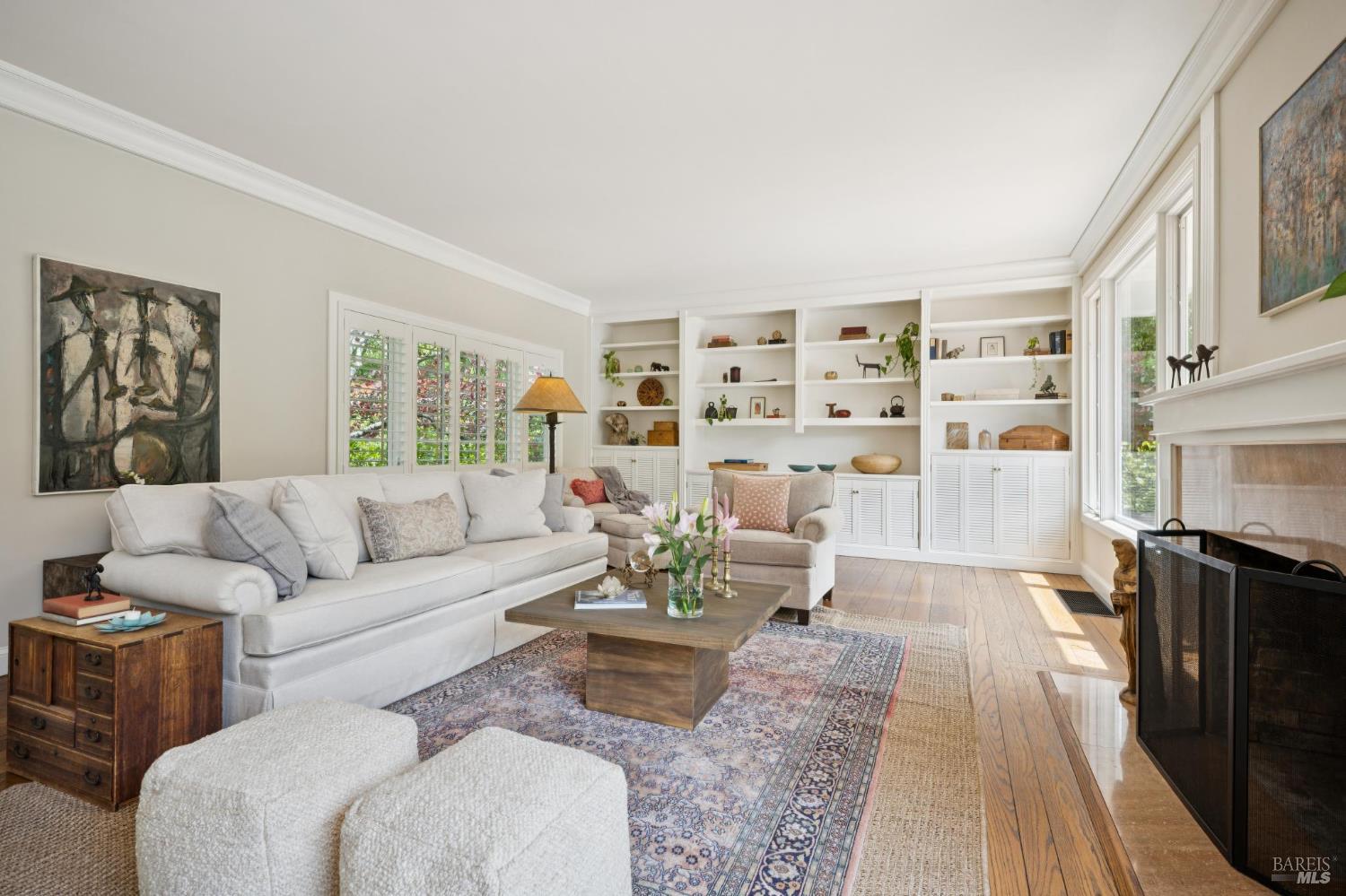 1199 Butterfield Road San Anselmo, CA 94960 - Photo 11 of 65 a living room with furniture large window and wooden floor