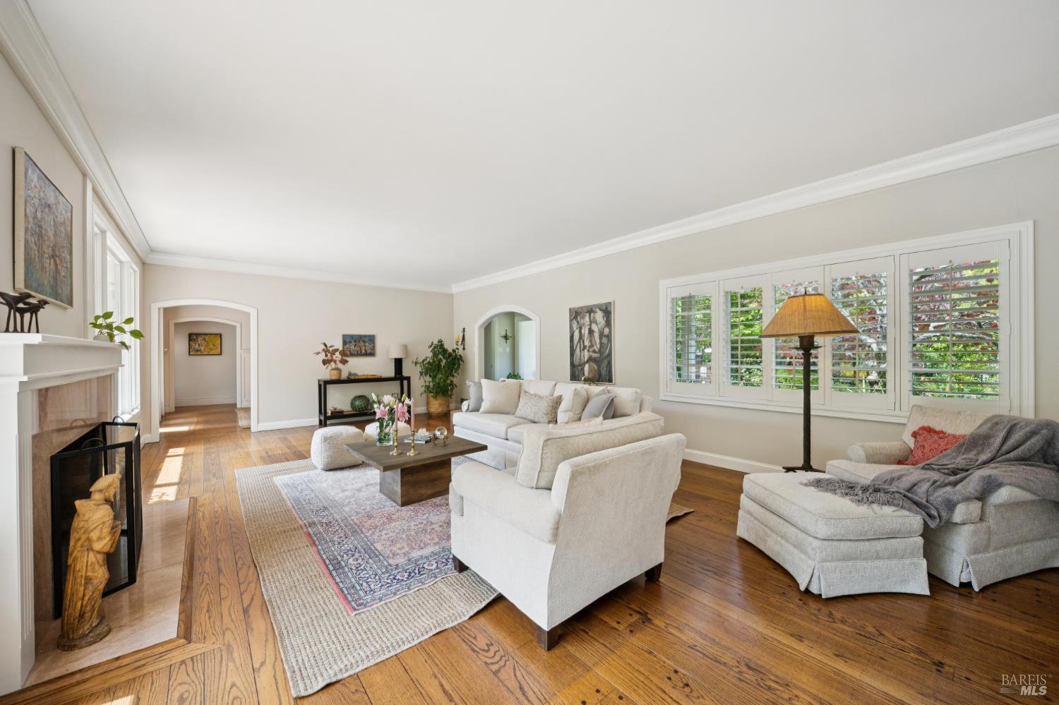 1199 Butterfield Road San Anselmo, CA 94960 - Photo 12 of 65 a living room with fireplace furniture and a large window