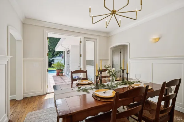 a view of a dining room with furniture window and wooden floor