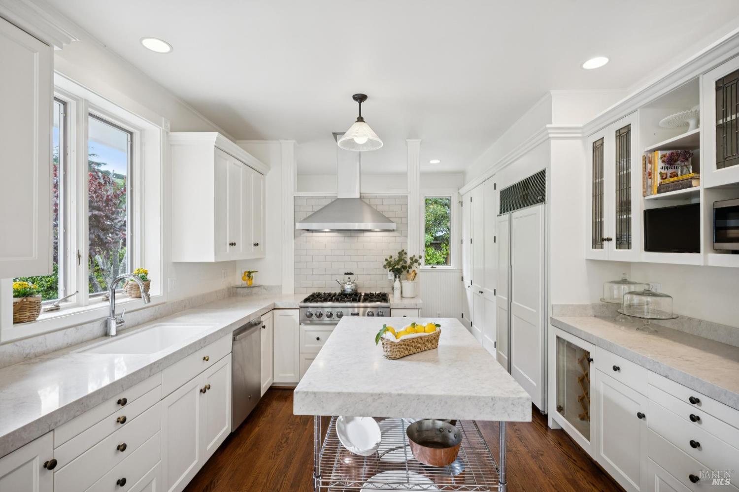 1199 Butterfield Road San Anselmo, CA 94960 - Photo 18 of 65 a kitchen with kitchen island a white counter top space a sink cabinets and stainless steel appliances