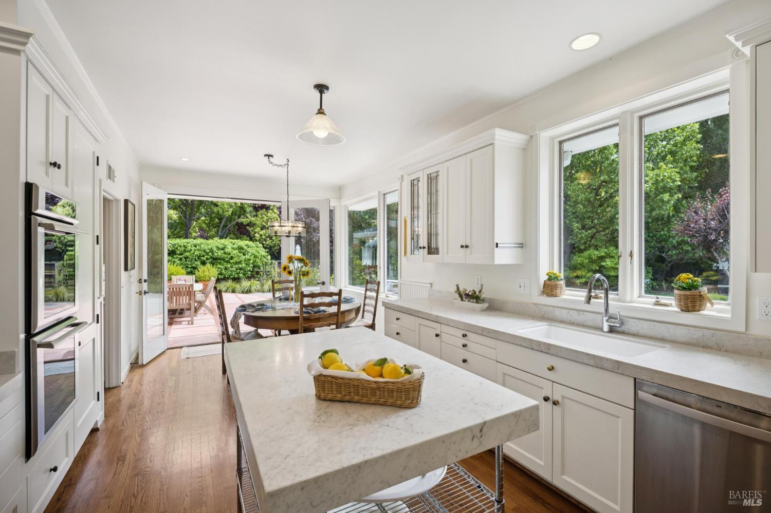 1199 Butterfield Road San Anselmo, CA 94960 - Photo 21 of 65 a kitchen with a large window and cabinets