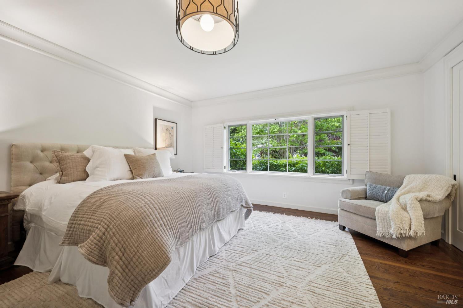 1199 Butterfield Road San Anselmo, CA 94960 - Photo 24 of 65 a spacious bedroom with a bed and a large window