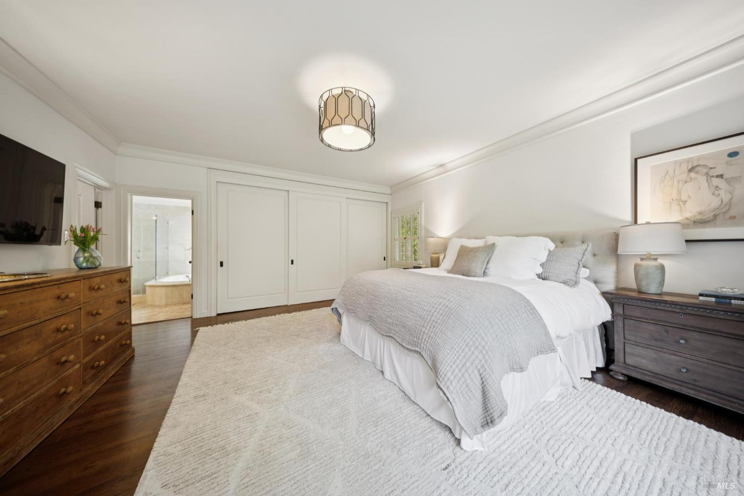 1199 Butterfield Road San Anselmo, CA 94960 - Photo 26 of 65 a bedroom with a bed and flat screen tv