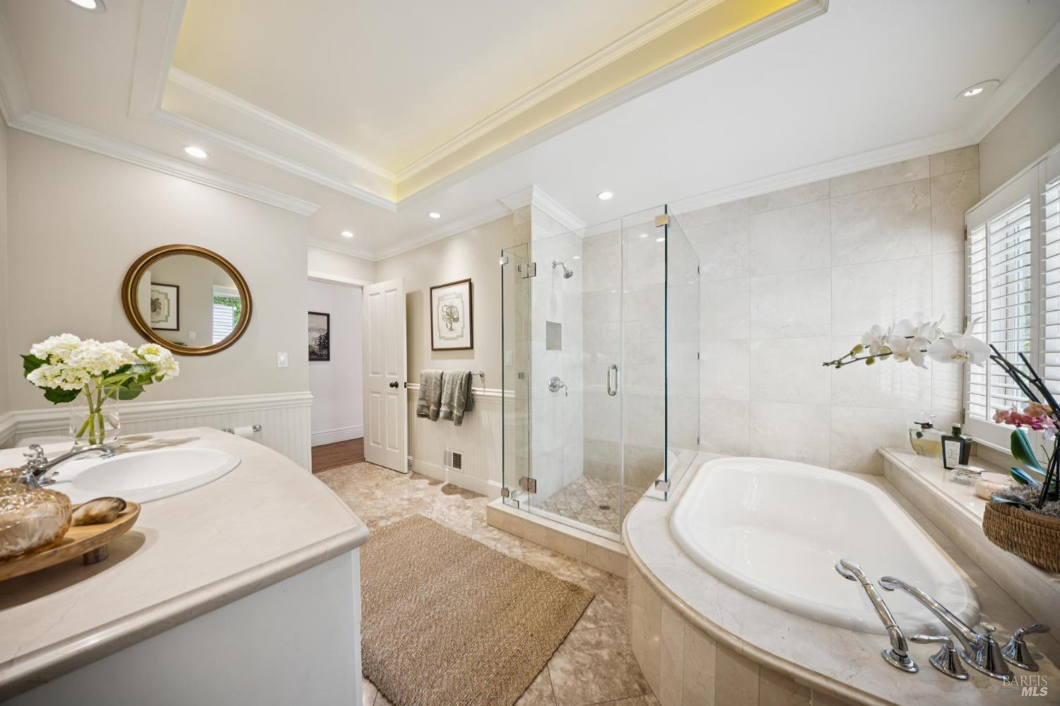 1199 Butterfield Road San Anselmo, CA 94960 - Photo 27 of 65 a spacious bathroom with a tub sink and mirror