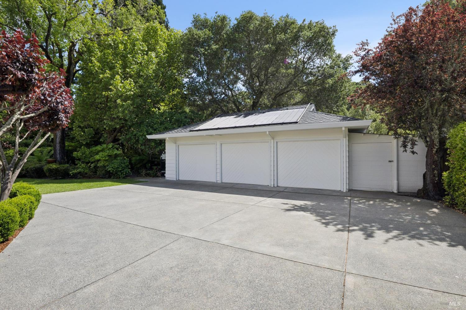 1199 Butterfield Road San Anselmo, CA 94960 - Photo 33 of 65 a front view of a house with a yard and garage