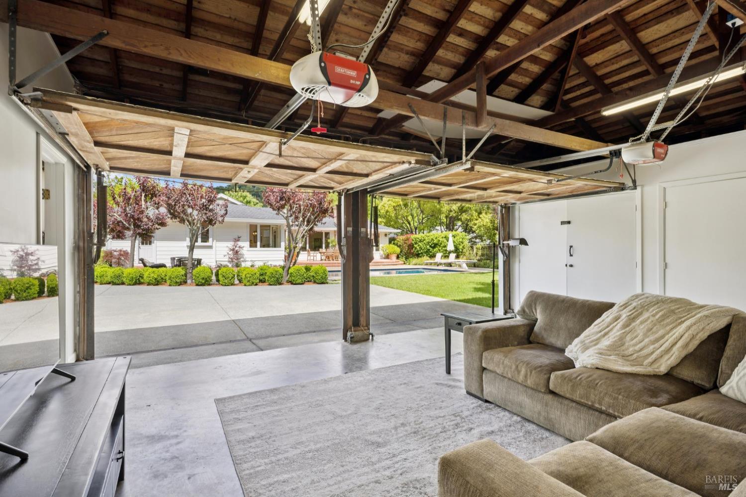 1199 Butterfield Road San Anselmo, CA 94960 - Photo 37 of 65 a living room with couch and a garden