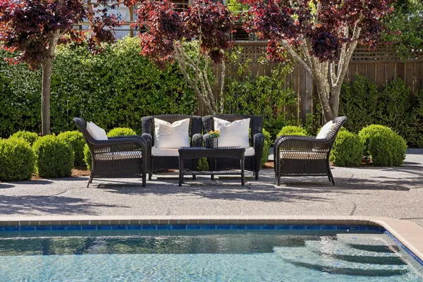 a view of a patio with couches table and chairs