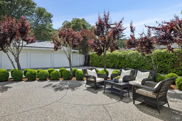 a view of house with outdoor space and swimming pool