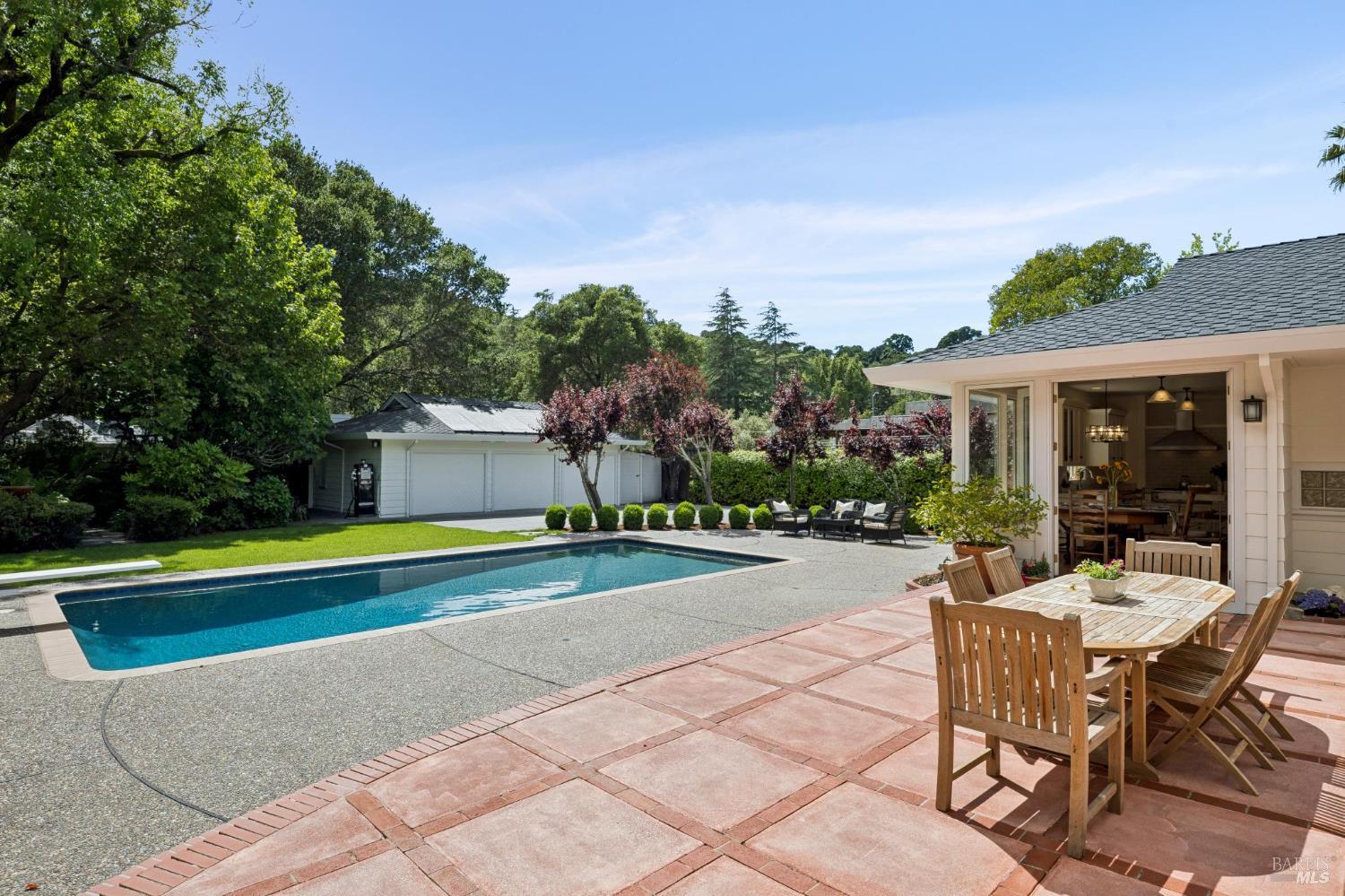 1199 Butterfield Road San Anselmo, CA 94960 - Photo 6 of 65 a view of a house with swimming pool and sitting area