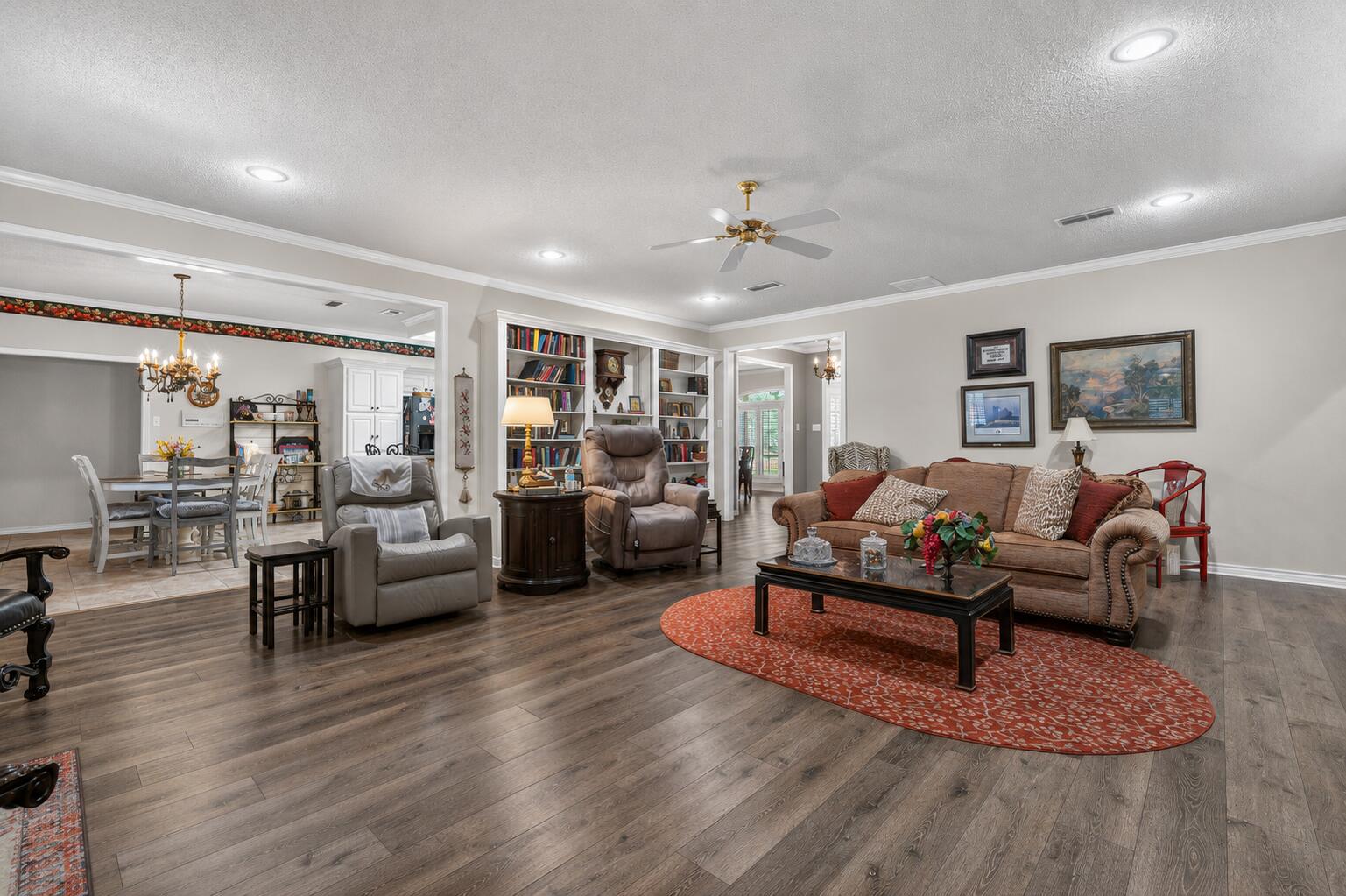 7402 95th Street Lubbock, TX 79424 - Photo 6 of 43 a living room with furniture and wooden floor