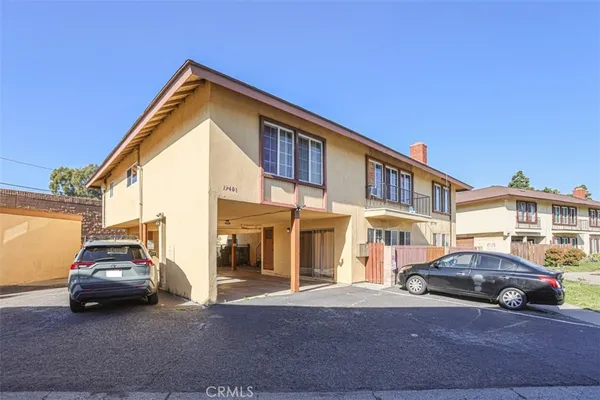 a view of a car park in front of house