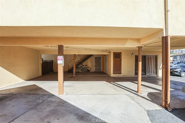 a view of a car park in front of house