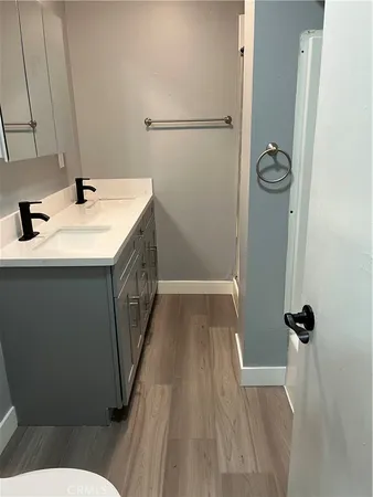 a bathroom with a sink a mirror and shower